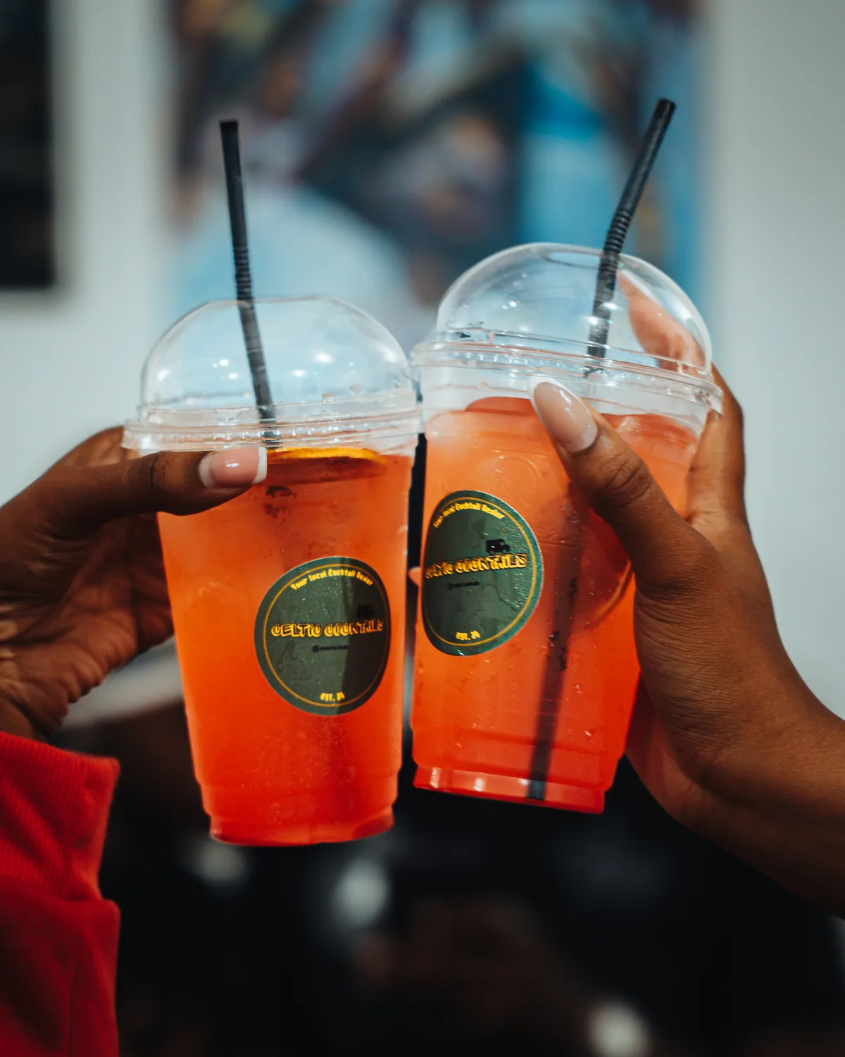 Two branded cups touched together at the pop-up