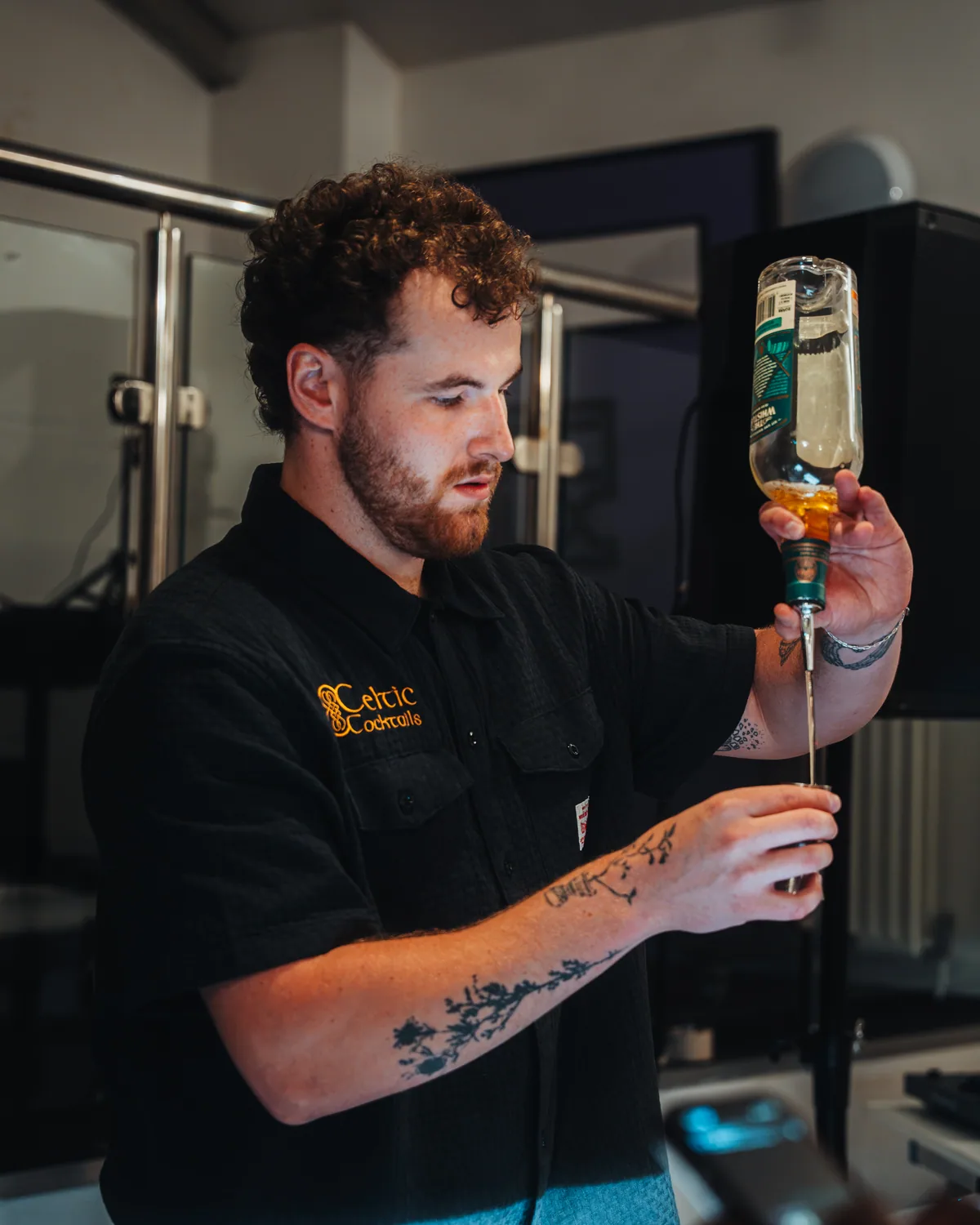 A mixologist working the bar