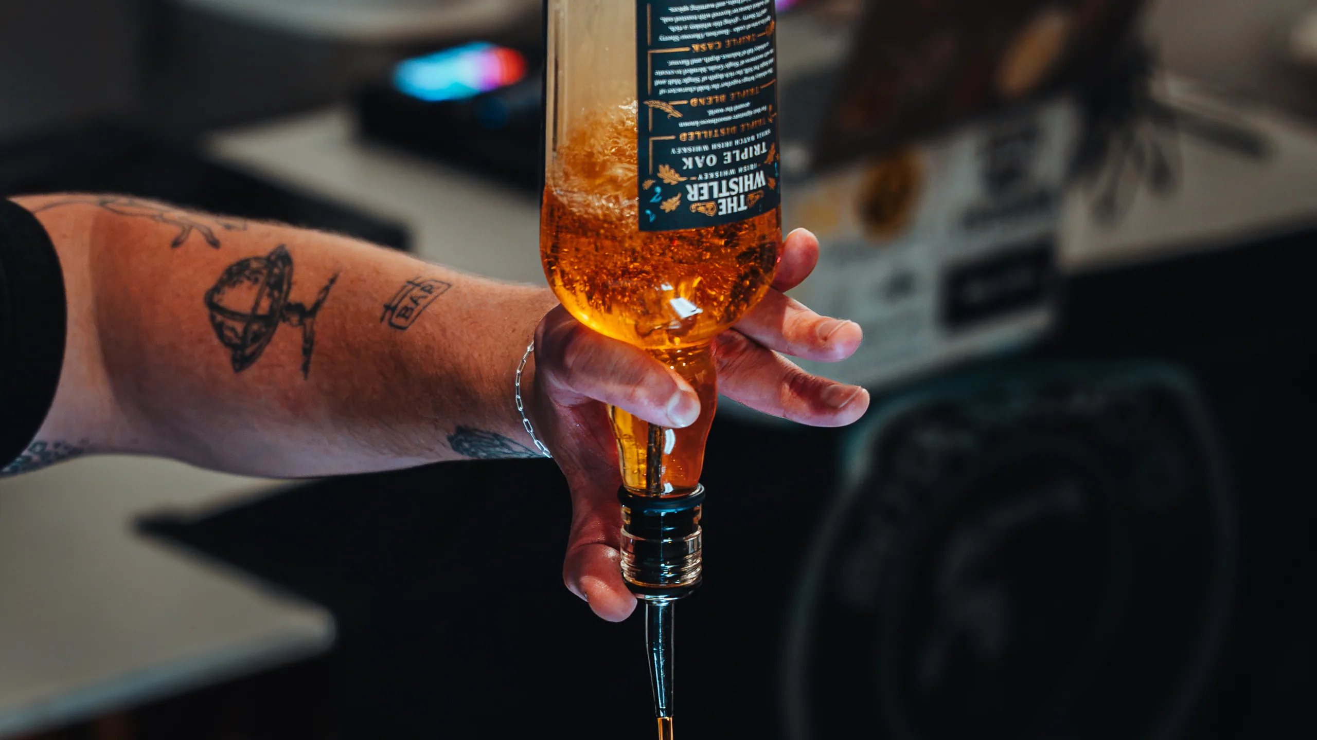 Pouring a cocktail behind the bar